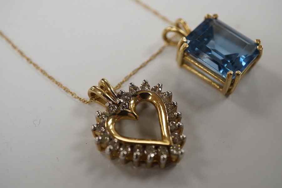 A modern 10K fine link chain, 46cm, together with a 10k and diamond set open heart shaped pendant, 21mm and a synthetic blue spinel pendant, gross weight 6.1 grams. Condition - fair to good